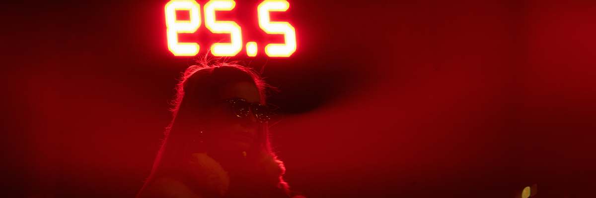 digital clock woman facing sideways clock
